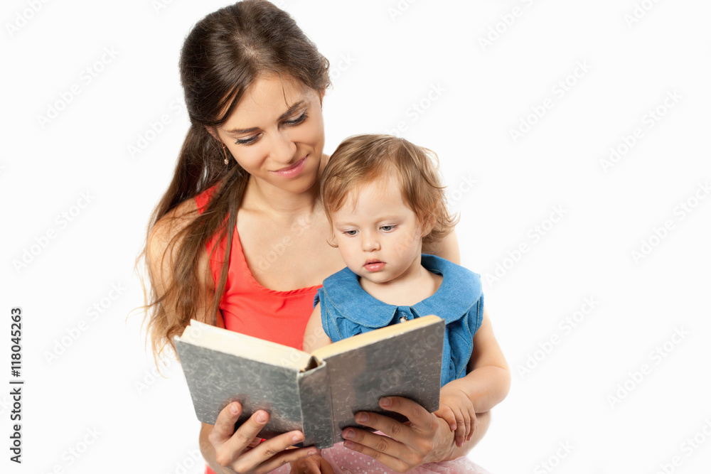 Mother is reading a book with her daughter Mother is reading a book with her daughter