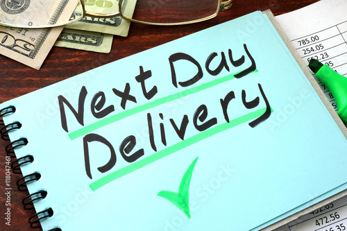 Next day delivery written on a notepad with marker.
