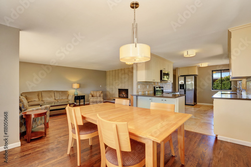 Dining room with maple table and exit to the back deck.