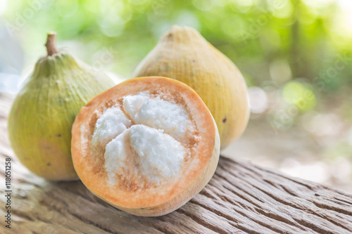 Santol fruit on wood photo