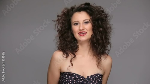 Wallpaper Mural Young brunette with long brown curly hair dancing  Torontodigital.ca