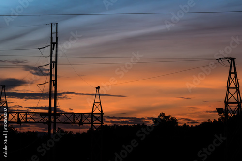 Silhouette of Electric Power Lines and High power transmission line at sunset