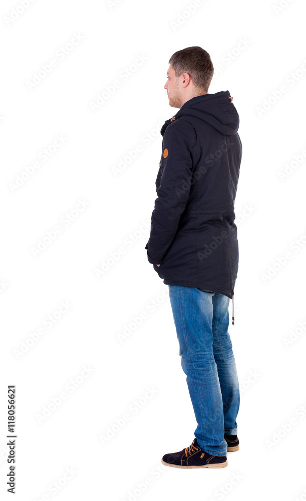 Back view of handsome man in winter jacket looking up. Standing young guy in parka. Rear view people collection. backside view of person. Isolated over white background. Man in warm jacket is Back view of handsome man in winter jacket looking up. Standing young guy in parka. Rear view people collection. backside view of person. Isolated over white background. Man in warm jacket is