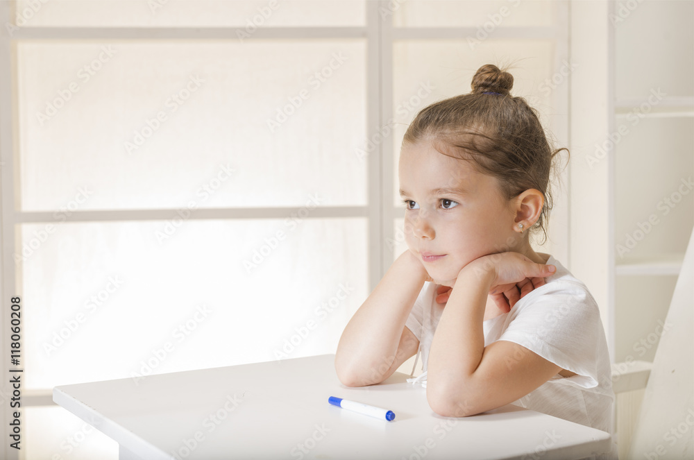 Little girl sitting at the desk waiting. Learn Study Education School Knowledge Concept Little girl sitting at the desk waiting. Learn Study Education School Knowledge Concept