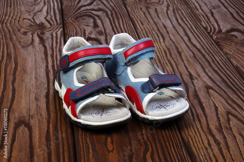 Child's sandals on a wood