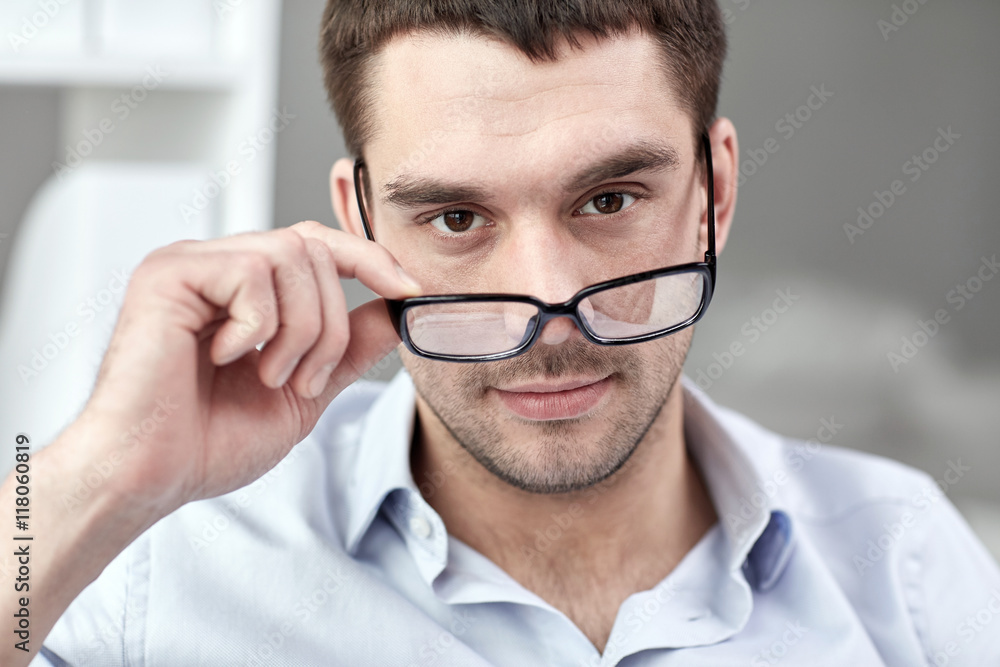 portrait of businessman in eyeglasses at office portrait of businessman in eyeglasses at office