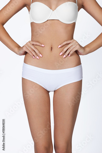 health and beauty - woman in cotton underwear showing slimming c