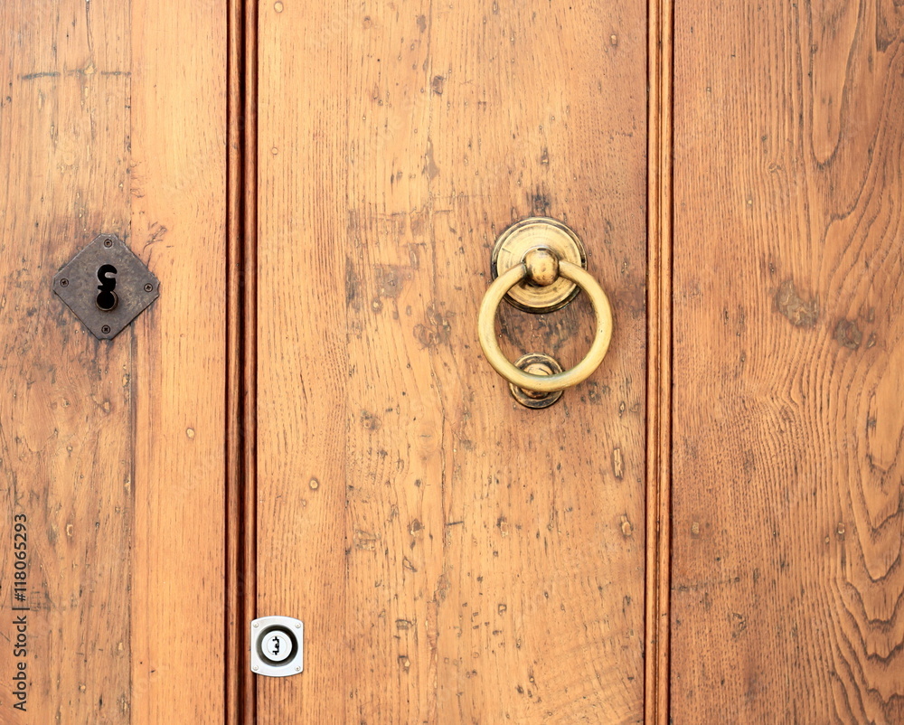 fragment ofold door with door handle of yellow metal fragment ofold door with door handle of yellow metal