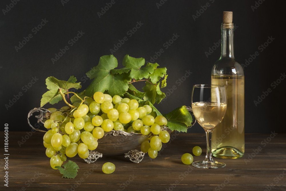 White wine, grape on silver basket