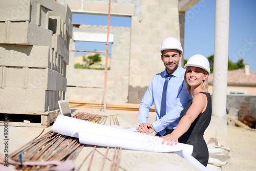 cute young woman architect with handsome foreman in building industry construction site © W PRODUCTION