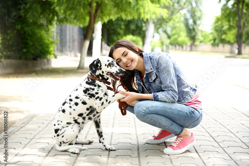 Owner with her dalmatian do...