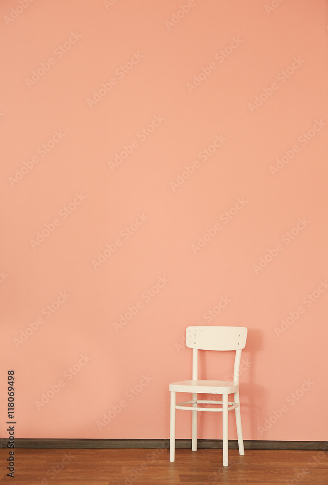 Modern chair on wall background Modern chair on wall background