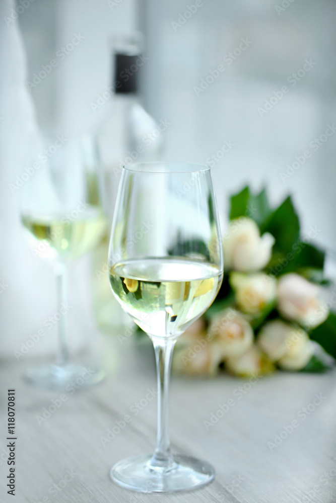 Gentle composition of romantic date with wine and flowers