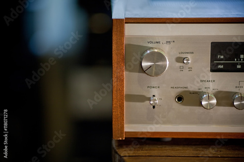Vintage stereo receiver in wooden cabinet