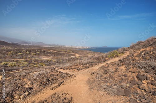 Path in scenic volcanic landscape in south Tenerife island, Canary islands, Spain.
