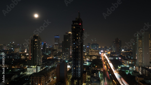 Bangkok panorama at night. View to the illuminated high-rise buildings and skyscrapers with transport traffic on highway. Capital of Thailand © danr13