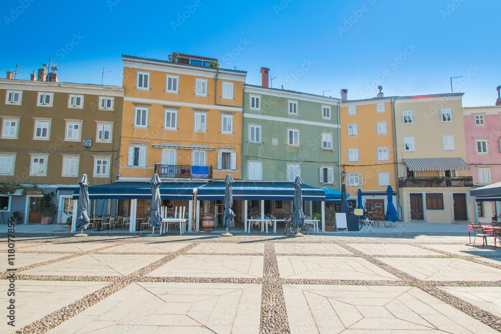 Fototapeta premium Old houses and cafes on waterfront in town of Cres, Island of Cres, Kvarner, Croatia 