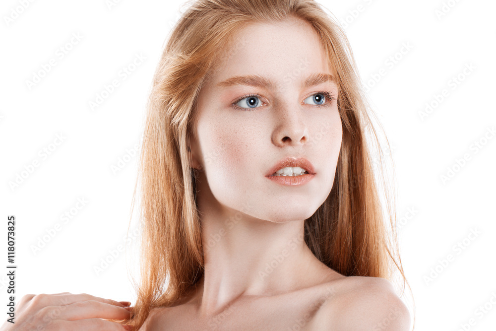 Portrait of a young red-haired girl on a white background. Portrait of a young red-haired girl on a white background.