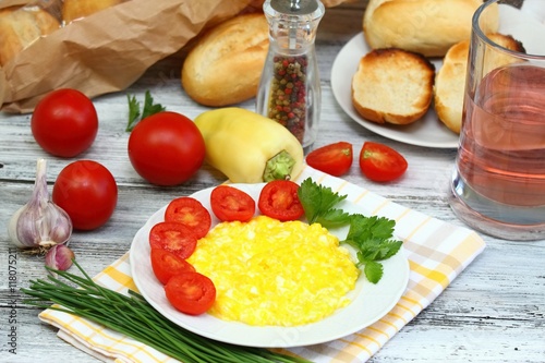 Breakfast of scrambled eggs, baguettes & vegetable