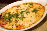 The baked fish with cheese and greens
