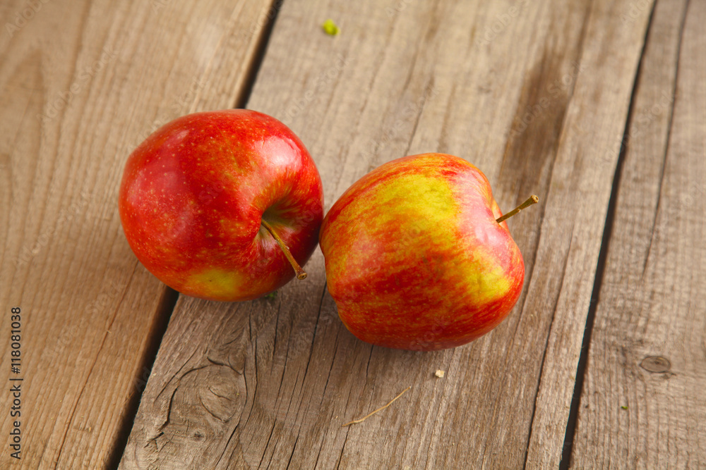 Red apples on a wooden plate the table Red apples on a wooden plate the table