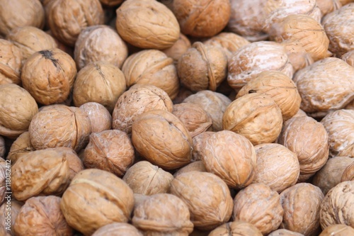 Closeup of English walnuts - background