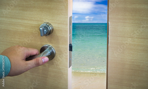 Open door in a beach with ocean and waves, concept photo