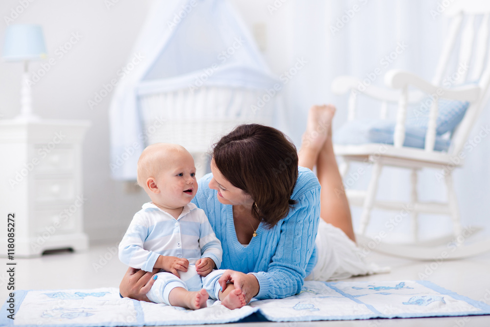 Mother and baby playing on the floor Mother and baby playing on the floor