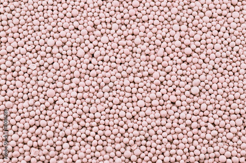 Pink composite mineral fertilizers. Background