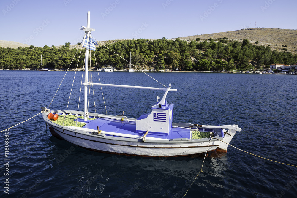 Traditional small fishing boat at sea in Lagkada village, Chios