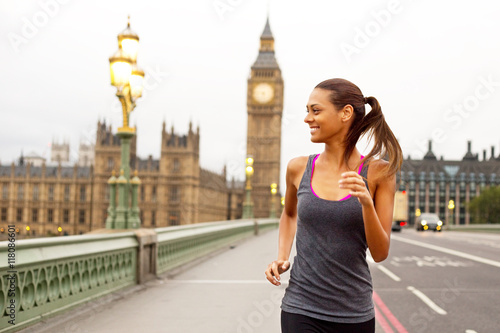 Photography young woman running over westminster bridge in london