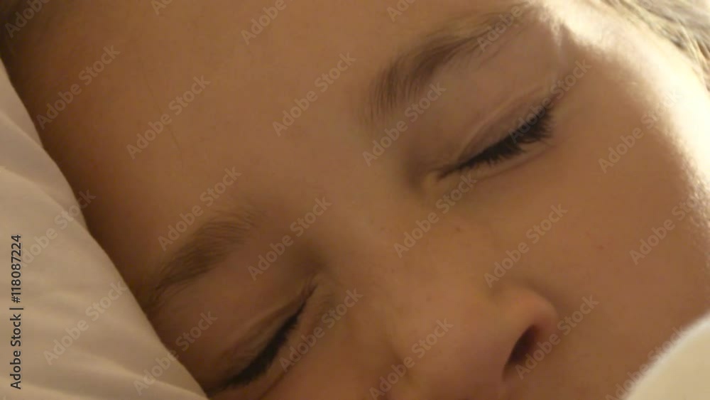Calm little blonde girl trying to to fall asleep in the bed close-up Calm little blonde girl trying to to fall asleep in the bed close-up
