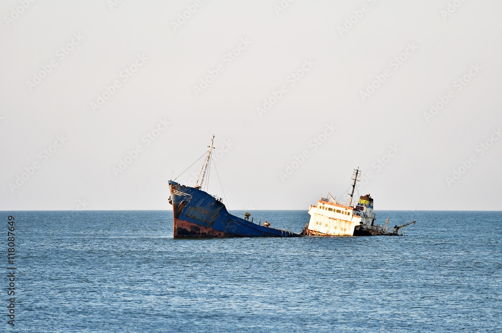 Industrial shipwreck abandoned into sea Industrial shipwreck abandoned into sea