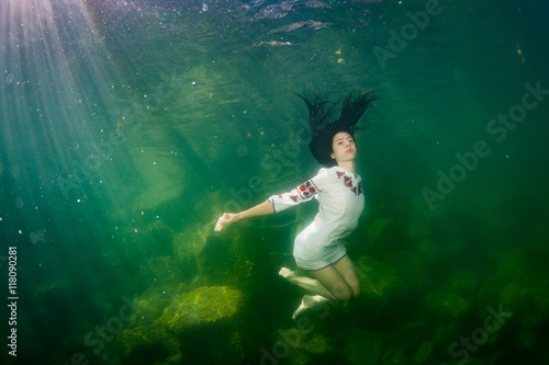 The girl in a embroidery under water © sergemi