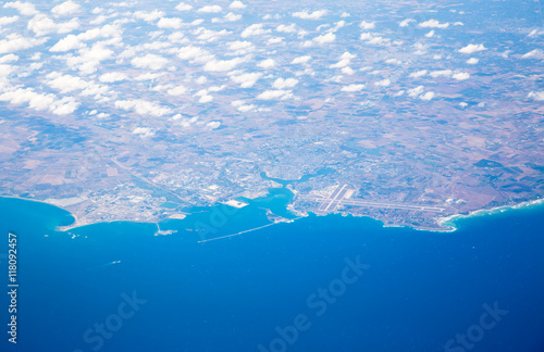 Fototapeta Naklejka Na Ścianę i Meble -  
Italy and sea cost line, aerial view from the airplane. View includes Brindisit town and airport 