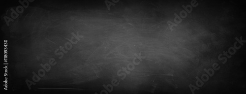 Blackboard or chalkboard texture background. Dark edges