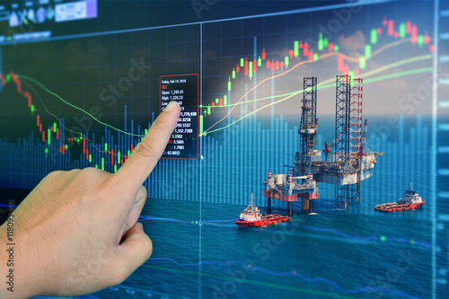 Stock market concept with oil rig in the gulf background,Double exposure