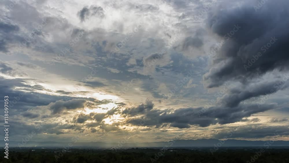 Time-lapse of Beautiful sunset scenery with Sun rays filtering through the clouds, casting a warm and enchanting glow on the hills of the valley. Time-lapse of Beautiful sunset scenery with Sun rays filtering through the clouds, casting a warm and enchanting glow on the hills of the valley.