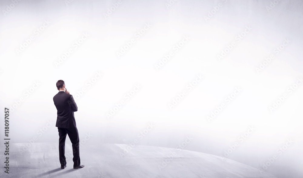 Business person standing from rear view Business person standing from rear view