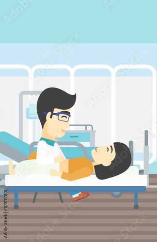 Doctor touching abdomen of female patient.