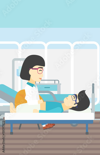 Doctor touching abdomen of male patient.