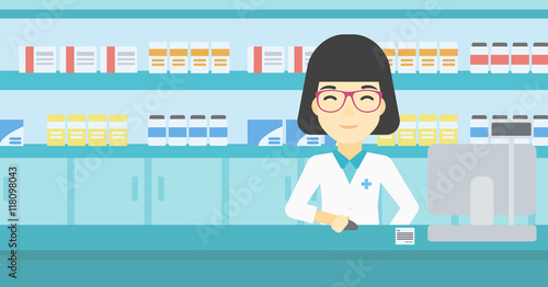 Pharmacist at counter with computer monitor.
