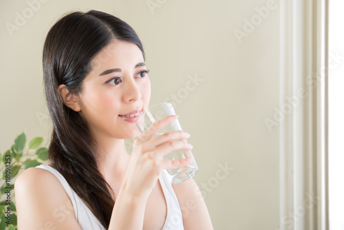 Smiling Woman Drinking Water with Healthy Lifestyle