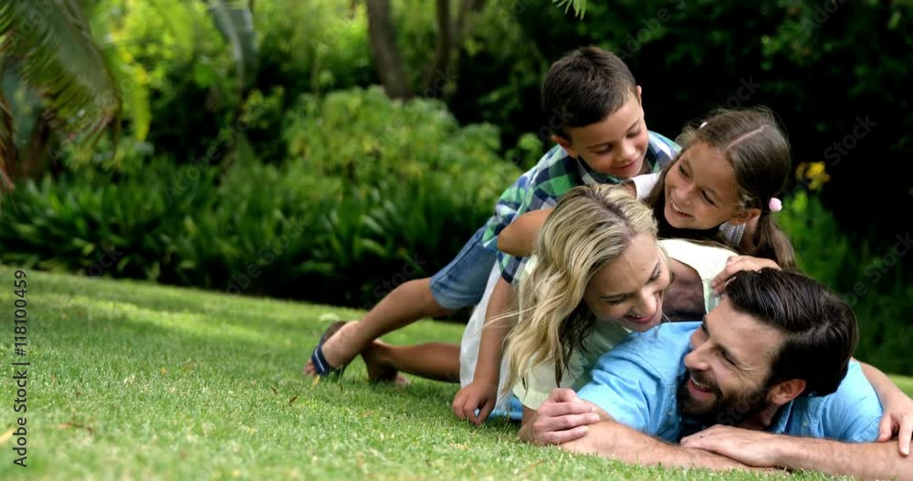Happy family posing together in the garden Happy family posing together in the garden