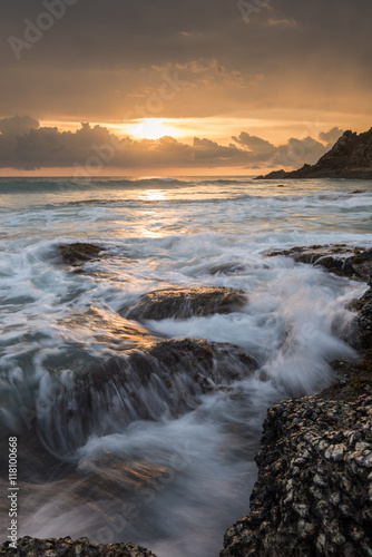 sea waves lash line impact rock on the beach