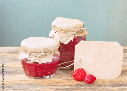 homemade raspberry jam in glass jar