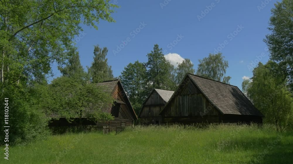 Three Wooden Hut in the Park in Summer Three Wooden Hut in the Park in Summer