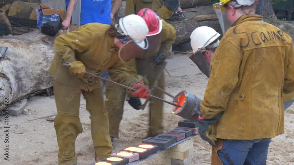 Three Men Poured Molten Iron in the Special Molds Three Men Poured Molten Iron in the Special Molds