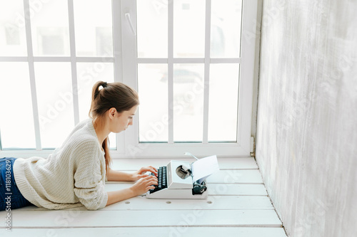 woman typing on retro machine window background