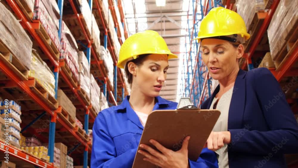 Warehouse worker working with clipboard Warehouse worker working with clipboard